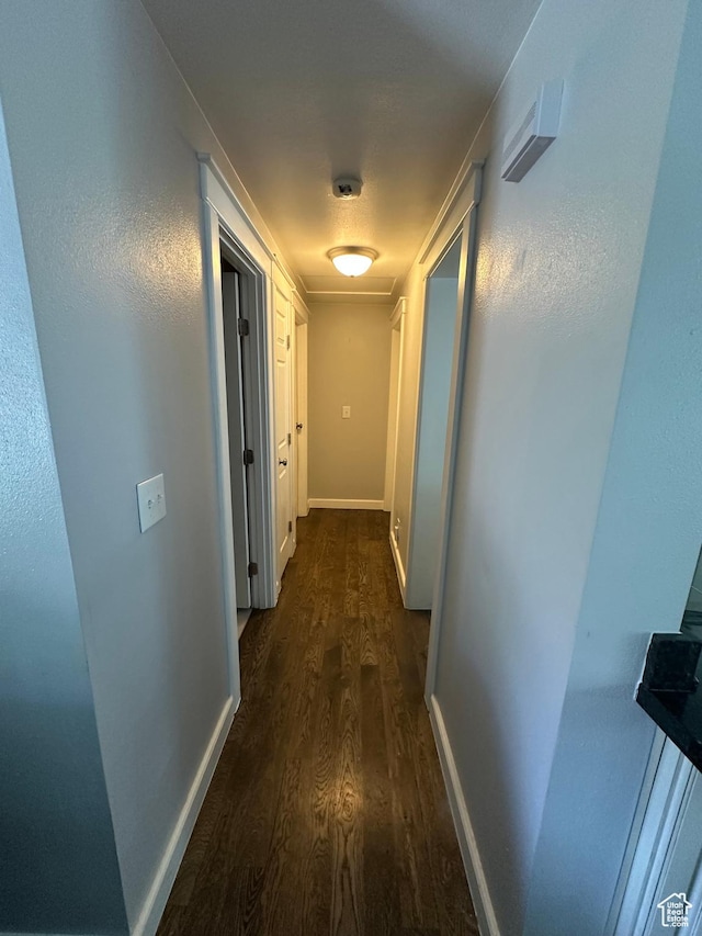 250 W 100 S, Duchesne, UT 84021 - hallway featuring dark wood-style floors and baseboards