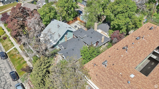 aerial view of property and surrounding area featuring nearby suburban area