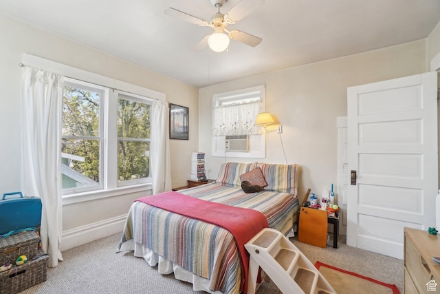 bedroom with carpet, baseboards, ceiling fan, and cooling unit