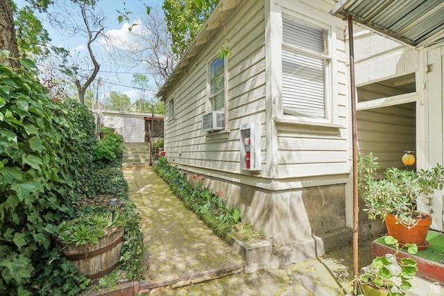view of side of home with cooling unit