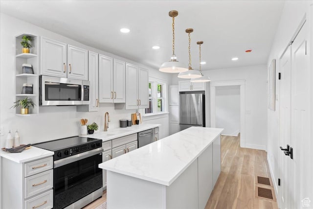 328 E Hampton Ave S, Salt Lake City, UT 84111 - kitchen featuring stainless steel appliances, open shelves, a kitchen island, recessed lighting, and light stone countertops