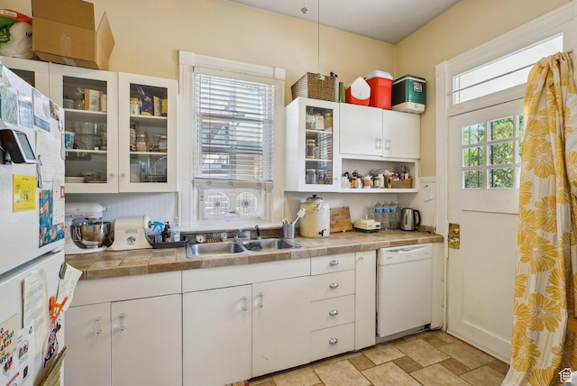 538 S 800 E, Salt Lake City, UT 84102 - kitchen with white appliances, white cabinetry, a sink, glass insert cabinets, and stone finish floors