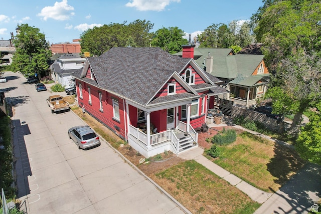 538 S 800 E, Salt Lake City, UT 84102 - view of front of house with covered porch, a chimney, and driveway