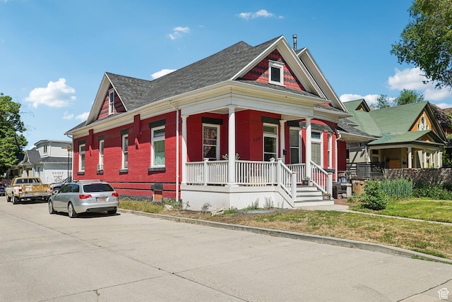 538 S 800 E, Salt Lake City, UT 84102 - view of front of home featuring covered porch, brick siding, and a shingled roof