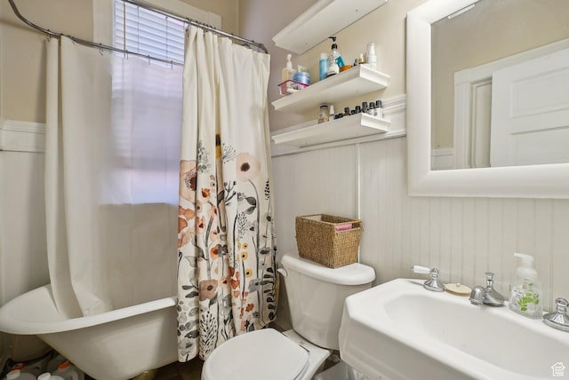 538 S 800 E, Salt Lake City, UT 84102 - bathroom featuring a sink, toilet, and a wainscoted wall