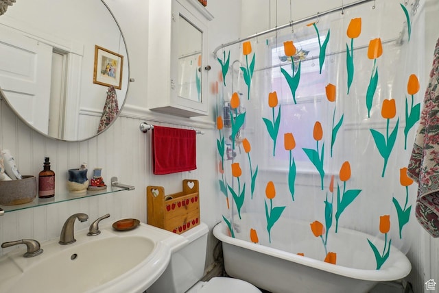 538 S 800 E, Salt Lake City, UT 84102 - bathroom featuring a sink, toilet, a decorative wall, and a wainscoted wall