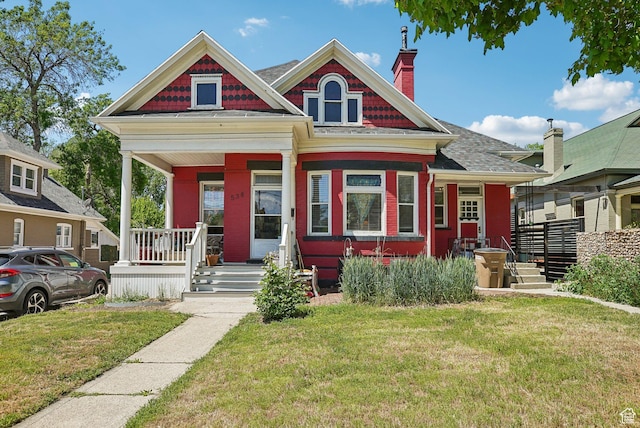 538 S 800 E, Salt Lake City, UT 84102 - view of front facade featuring covered porch, a front lawn, a chimney, and a shingled roof