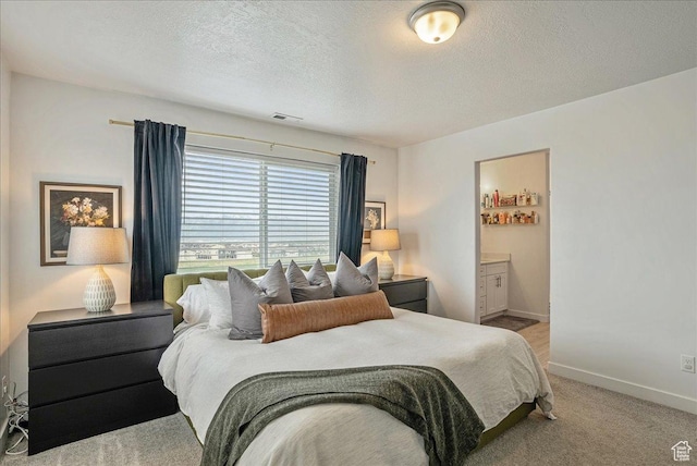 7881 S Highlandpoint Way, West Jordan, UT 84081 - carpeted bedroom featuring baseboards, a textured ceiling, and ensuite bath