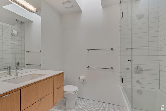 608 S 400 E, Salt Lake City, UT 84111 - bathroom with tile patterned floors, toilet, bath / shower combo with glass door, and vanity