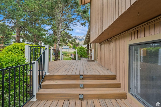 wooden deck featuring a mountain view