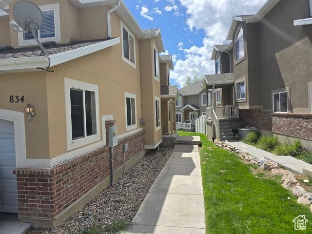 834 N Sapphire St, Morgan, UT 84050 - view of home's exterior featuring stucco siding, brick siding, and a residential view