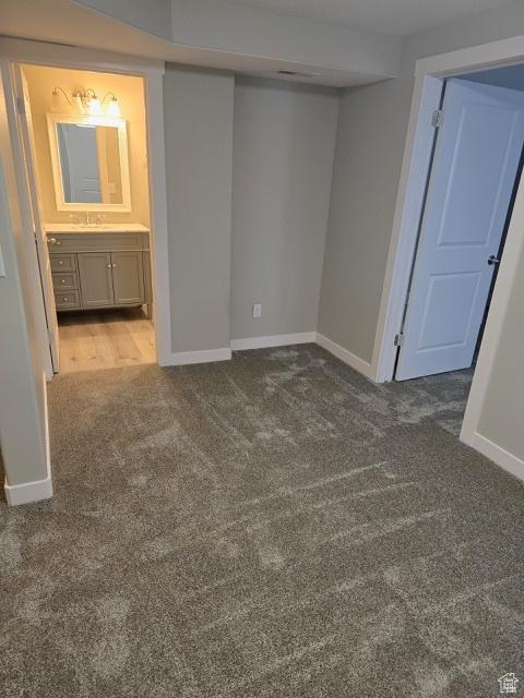 834 N Sapphire St, Morgan, UT 84050 - spare room featuring baseboards, carpet flooring, and a sink