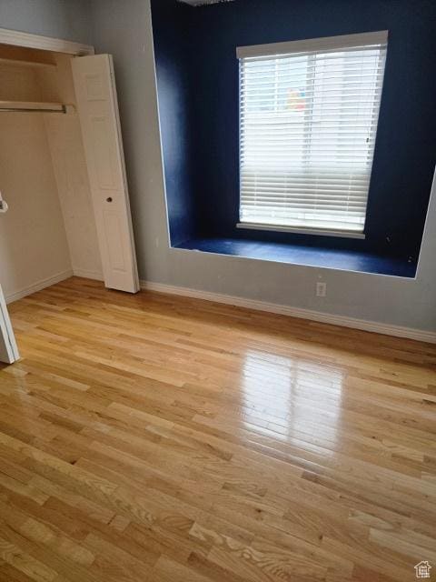 834 N Sapphire St, Morgan, UT 84050 - unfurnished bedroom featuring light wood-style flooring, baseboards, and a closet