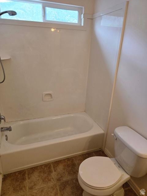 834 N Sapphire St, Morgan, UT 84050 - bathroom with toilet, tile patterned floors, and  shower combination