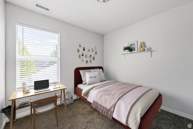 bedroom featuring carpet floors, baseboards, and an office area