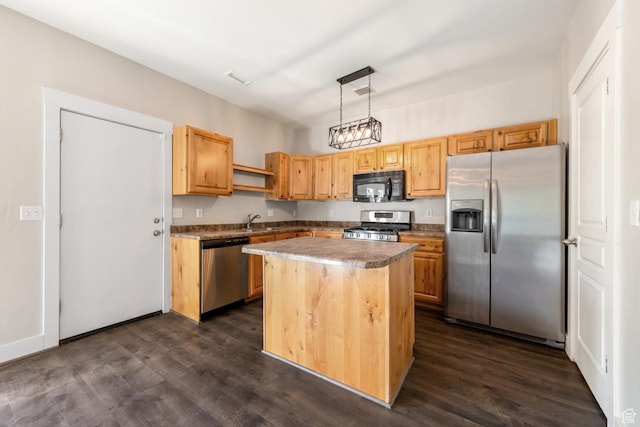 kitchen with stainless steel appliances, dark wood finished floors, open shelves, a sink, and pendant lighting