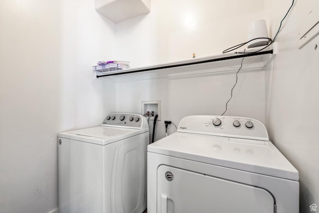 clothes washing area featuring washing machine and clothes dryer