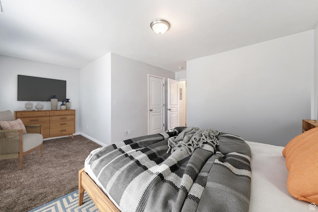 carpeted bedroom featuring baseboards