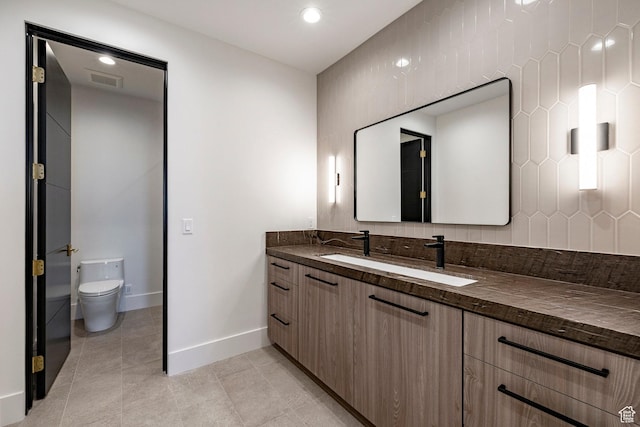 1964 E Upper Lookout Knoll Cir Unit 371, Heber City, UT 84032 - bathroom featuring vanity, tile patterned flooring, backsplash, and recessed lighting