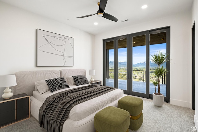carpeted bedroom with access to exterior, recessed lighting, a mountain view, ceiling fan, and baseboards