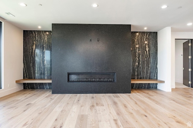 1964 E Upper Lookout Knoll Cir Unit 371, Heber City, UT 84032 - unfurnished living room with a large fireplace, wood finished floors, and recessed lighting