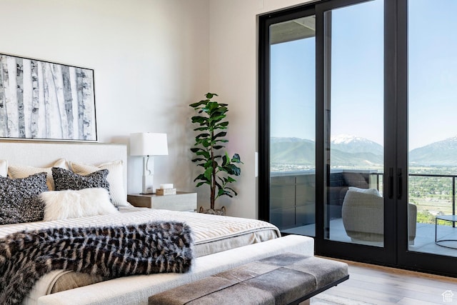 1964 E Upper Lookout Knoll Cir Unit 371, Heber City, UT 84032 - bedroom with wood finished floors, a mountain view, access to exterior, and french doors