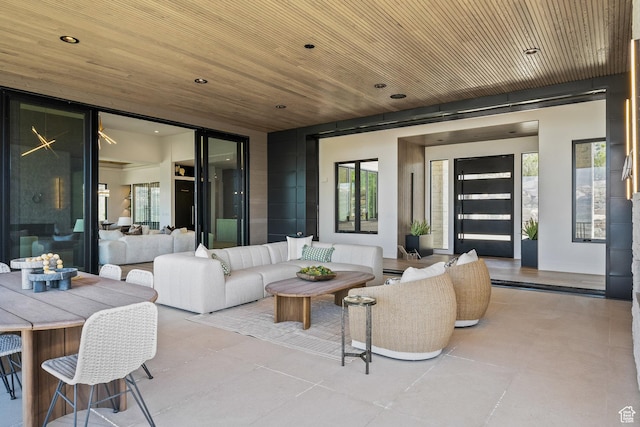 tiled living room featuring plenty of natural light, recessed lighting, and wooden ceiling