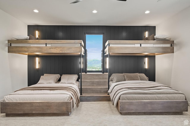 bedroom with recessed lighting and wood finished floors