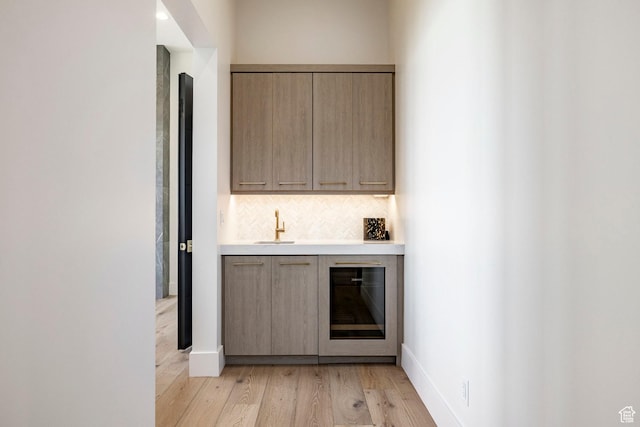 1964 E Upper Lookout Knoll Cir Unit 371, Heber City, UT 84032 - indoor bar with light wood-style flooring and tasteful backsplash