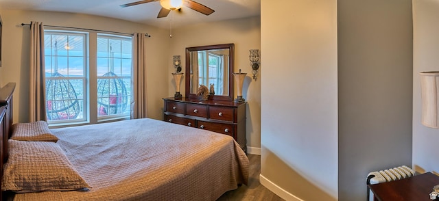 15059 S Rose Creek Ln, Herriman, UT 84096 - bedroom featuring baseboards and wood finished floors