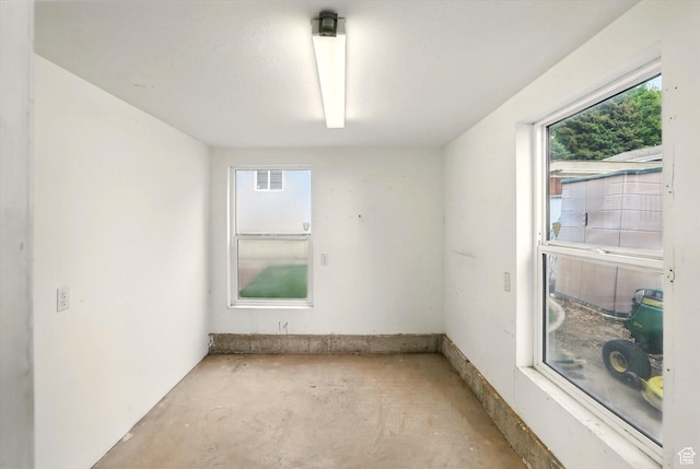 empty room featuring concrete flooring