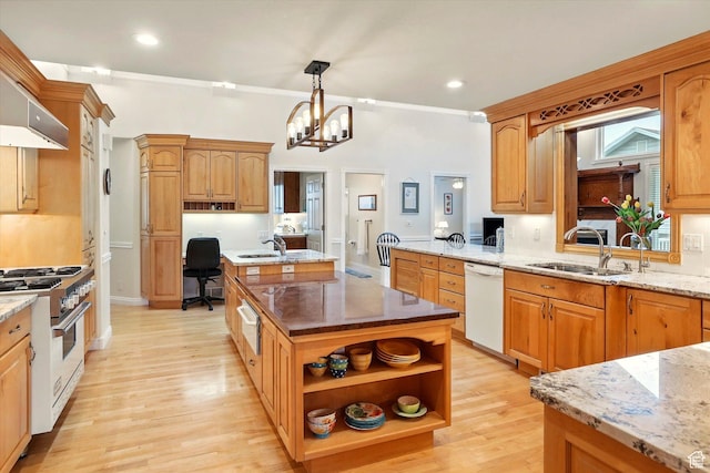 kitchen featuring gas range oven, dishwasher, a sink, a warming drawer, and a desk