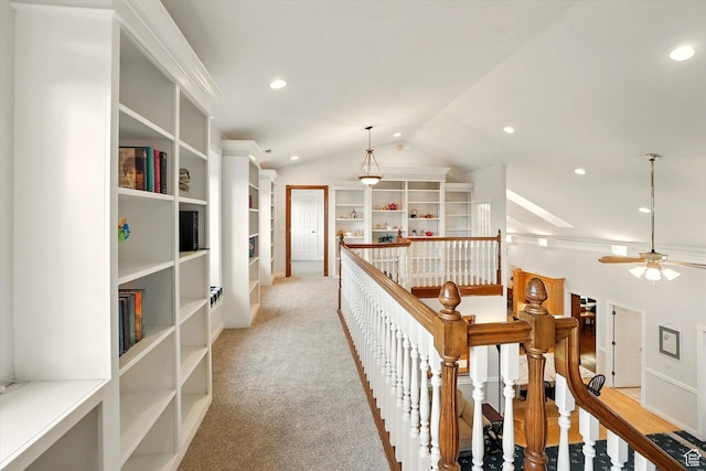 hallway featuring an upstairs landing, vaulted ceiling, recessed lighting, and light carpet