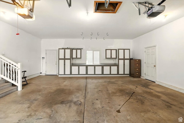 garage featuring a garage door opener