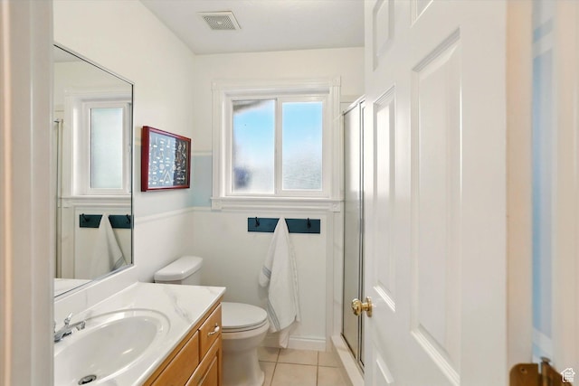 full bathroom with tile patterned flooring, a stall shower, toilet, and vanity