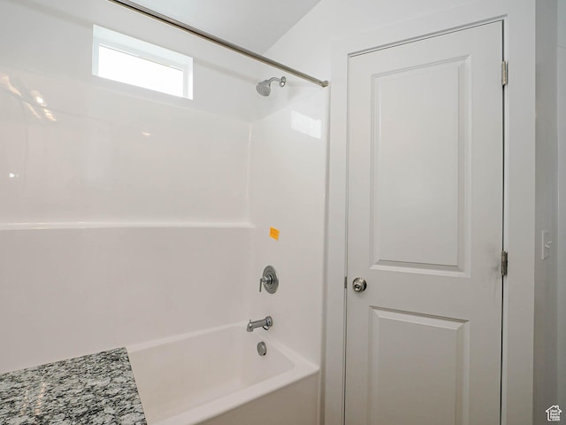bathroom with washtub / shower combination