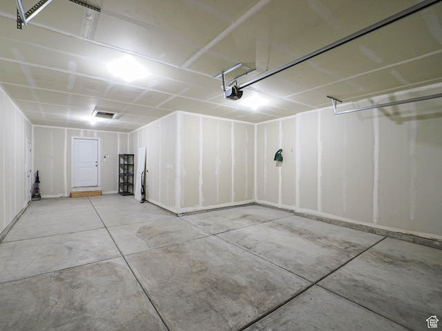 garage featuring a garage door opener