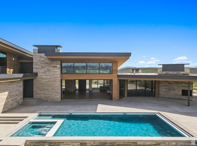 7455 N Promontory Ranch Rd, Park City, UT 84098 - view of swimming pool featuring a patio and a pool with connected hot tub