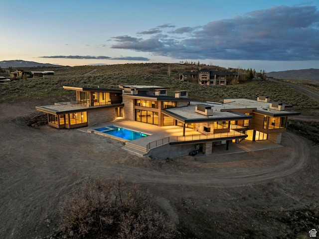 7455 N Promontory Ranch Rd, Park City, UT 84098 - pool at dusk with an outdoor pool and a mountain view