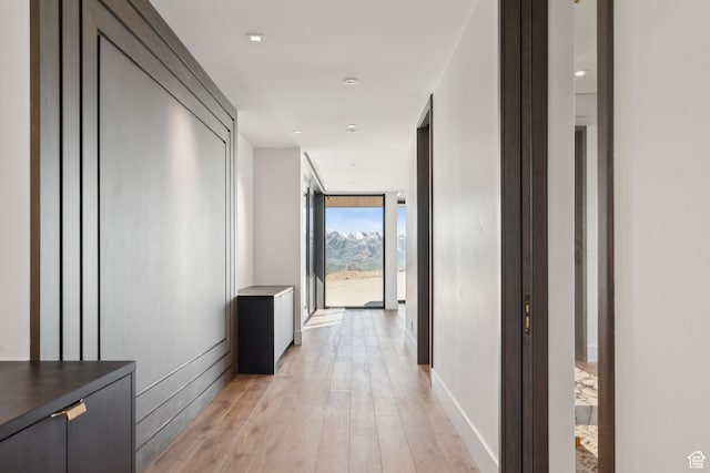 7455 N Promontory Ranch Rd, Park City, UT 84098 - corridor with a wall of windows, light wood-style flooring, and baseboards