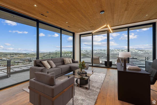 7455 N Promontory Ranch Rd, Park City, UT 84098 - living area featuring expansive windows, wooden ceiling, light wood-style floors, and a mountain view