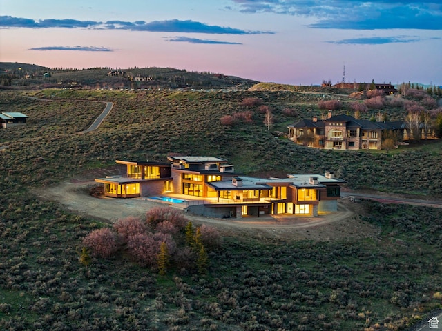 7455 N Promontory Ranch Rd, Park City, UT 84098 - back of house at dusk featuring a balcony