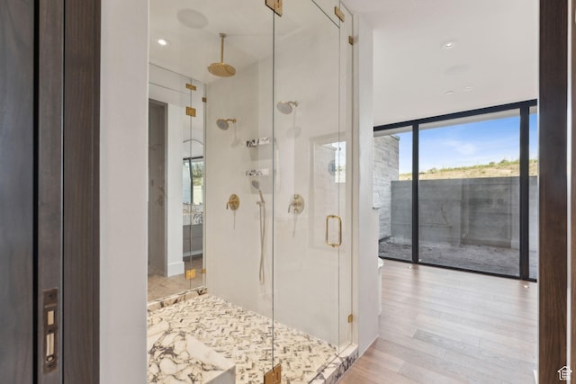 7455 N Promontory Ranch Rd, Park City, UT 84098 - full bath with a shower stall, a wall of windows, and wood finished floors