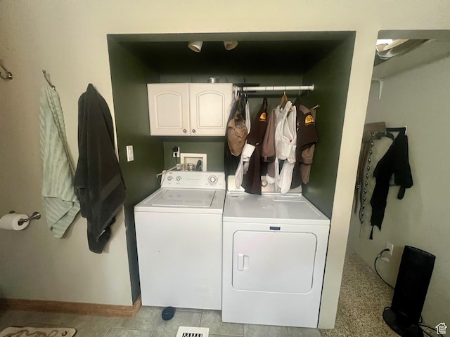 465 E Kings Ln, Green River, UT 84525 - washroom featuring washing machine and dryer, cabinet space, and baseboards