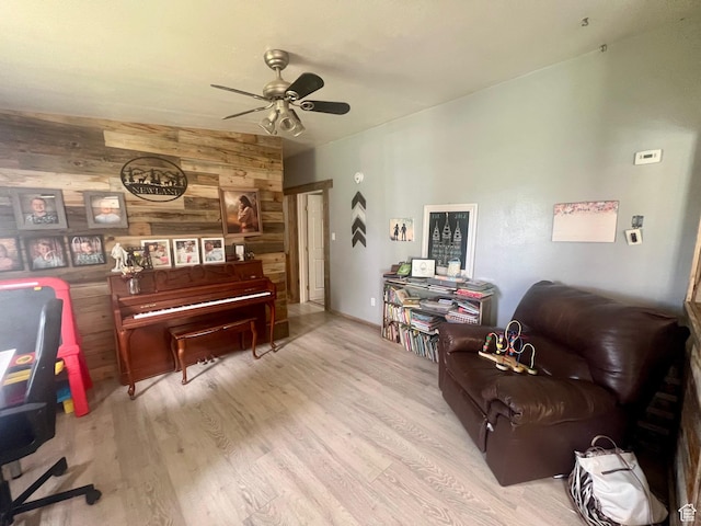 465 E Kings Ln, Green River, UT 84525 - living area with wooden walls, ceiling fan, and wood finished floors