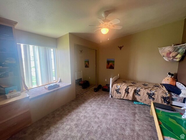 465 E Kings Ln, Green River, UT 84525 - bedroom with carpet flooring and ceiling fan