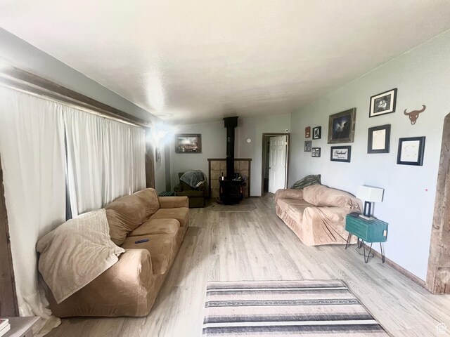 465 E Kings Ln, Green River, UT 84525 - living area with a wood stove and wood finished floors