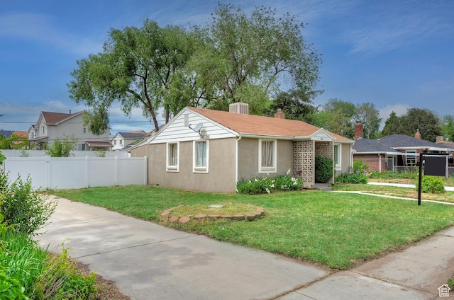 1154 S Montgomery St W, Salt Lake City, UT 84104 - view of front of property with stucco siding, a chimney, and driveway