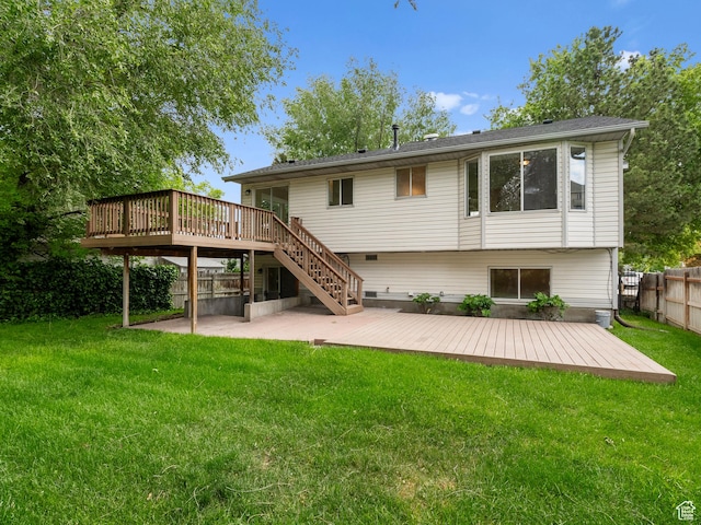 back of property featuring a wooden deck, a patio, and stairs