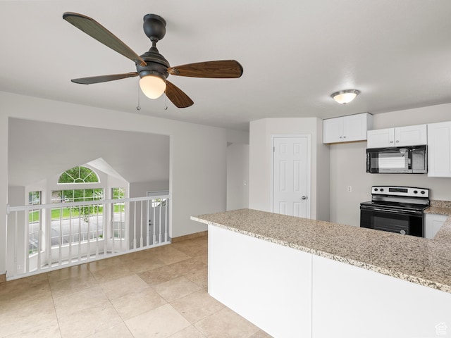 kitchen with electric stove, black microwave, a peninsula, light stone countertops, and white cabinetry